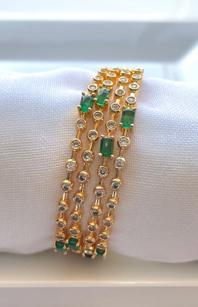 Elegant Set of 4 White Bangles with Green Stone Accents