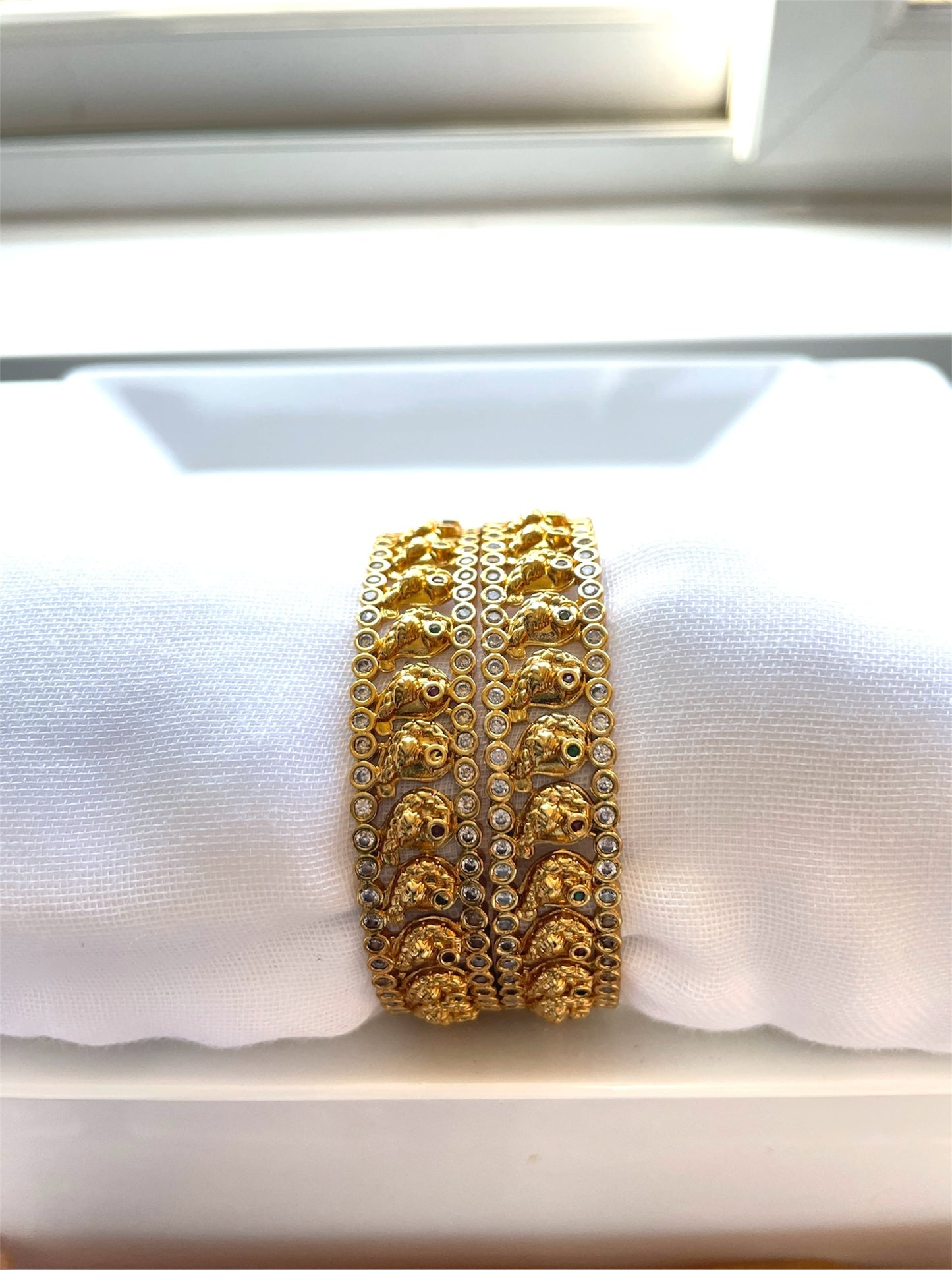 Gold Bangle with Sparkling White Stones and Bird Motif