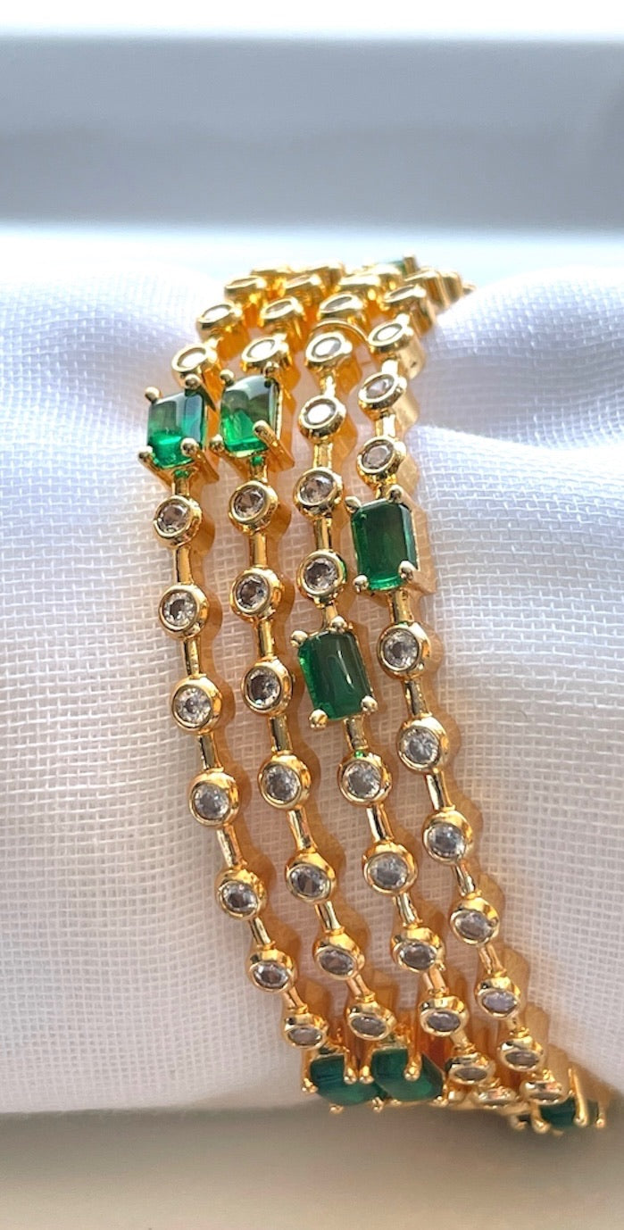 Elegant Set of 4 White Bangles with Green Stone Accents