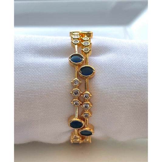 Elegant White Bangle with Blue Stone Accents